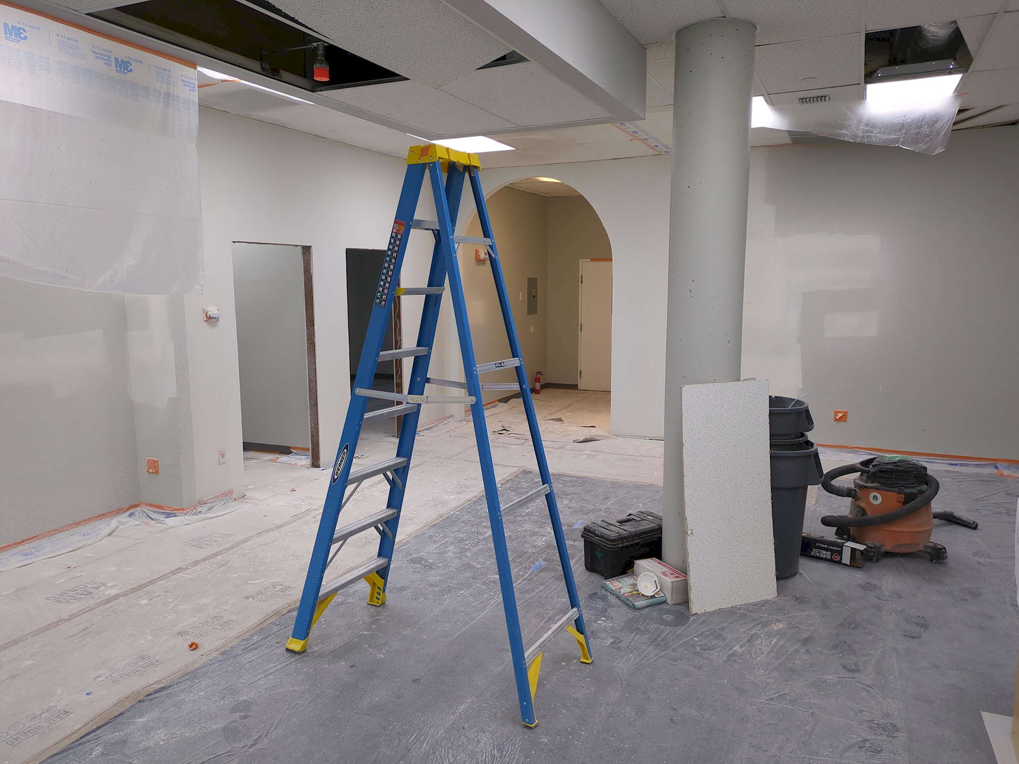 SDG pre-construction 10 Another view of the same area from the opposite corner. This shows missing ceiling tiles (but no damaged ones) and a pair of unfinished doorways to the left.